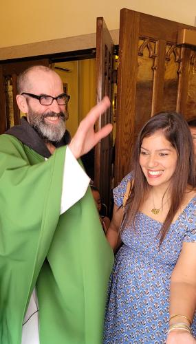 Father Peter and a parishioner