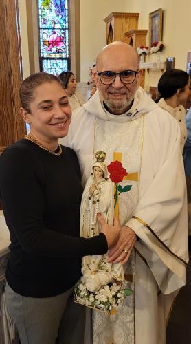 Father Jorge and parishioner